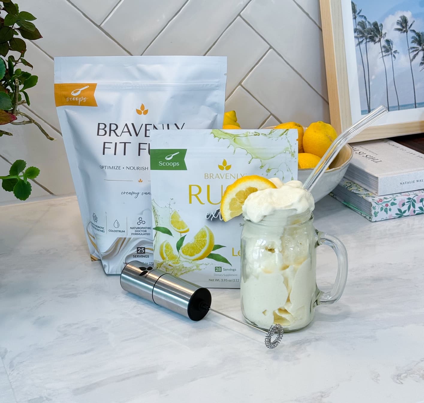 Bravenly Fit Fuel, Rush Extreme - Fresh Lemonade, and a Frother on a kitchen counter.